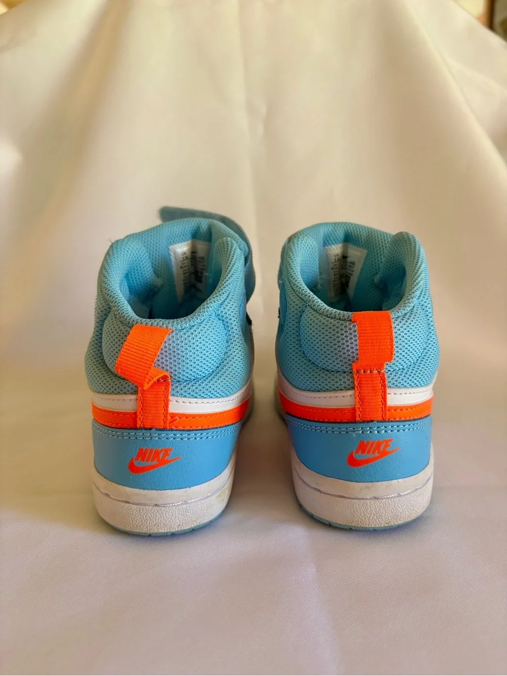 Nike Kids Mid-Top Sneakers in Aqua, White & Bright Orange
